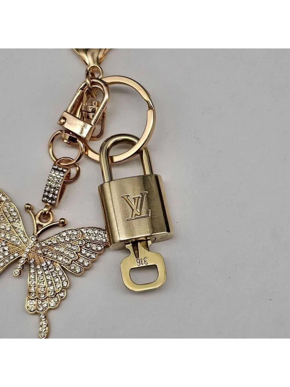 Louis Vuitton Authentic Gold Lock 🔒 Unbranded Butterfly Keychain for Bags